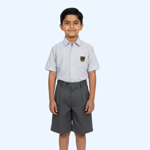 Child wearing a striped shirt and gray shorts on a white background
